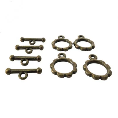 Lot de 4 fermoirs anneaux avec bâtonnets formes fleurs couleur bronze